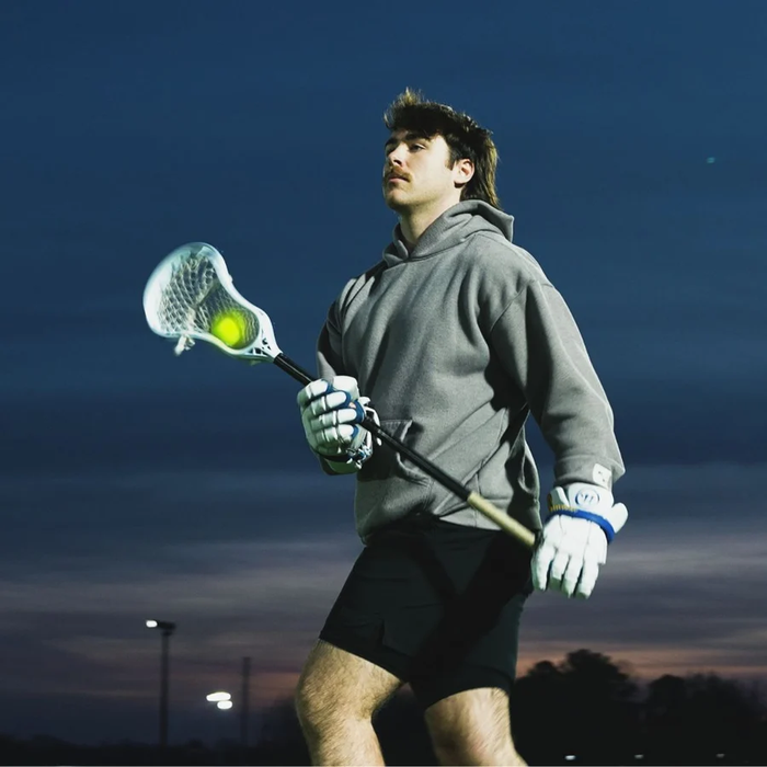 A case of 100 PEARL X Lacrosse Balls - Optic Yellow (Fluorescent Game Lacrosse Ball), White, Yellow, Orange