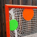 Green and orange top shelf target on lacrosse goal